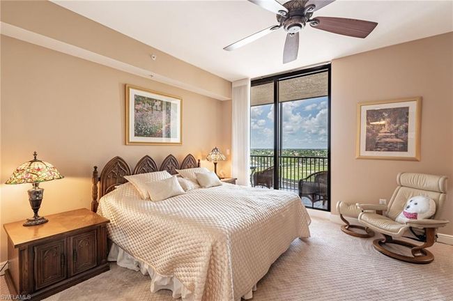 Bedroom featuring carpet flooring, access to outside, a wall of windows, and ceiling fan | Image 30