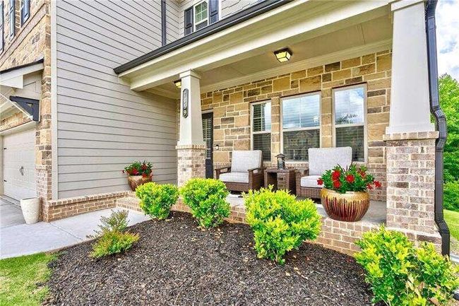 7059 Lancaster Xing, House other with 4 bedrooms, 3 bathrooms and 3 parking in Flowery Branch GA | Image 4