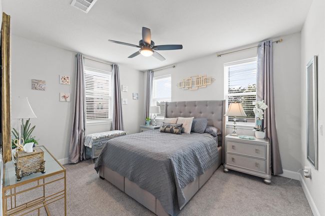 Comfortable and well-sized with multiple windows—perfect as a guest suite, nursery, home office, or long-term secondary bedroom. | Image 15