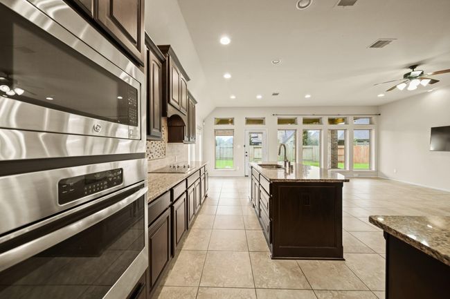 Large kitchen open to the family room. | Image 6