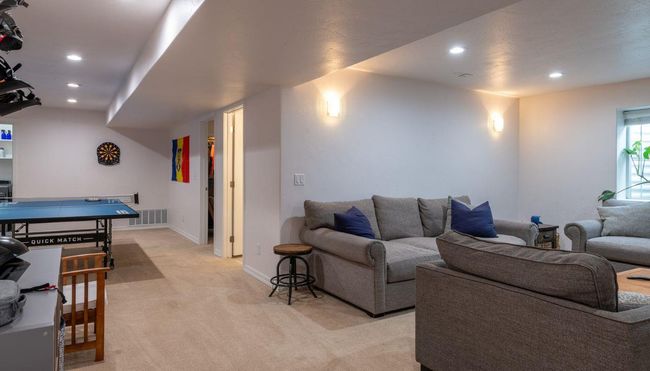 Living area with light carpet, recessed lighting, and baseboards | Image 25