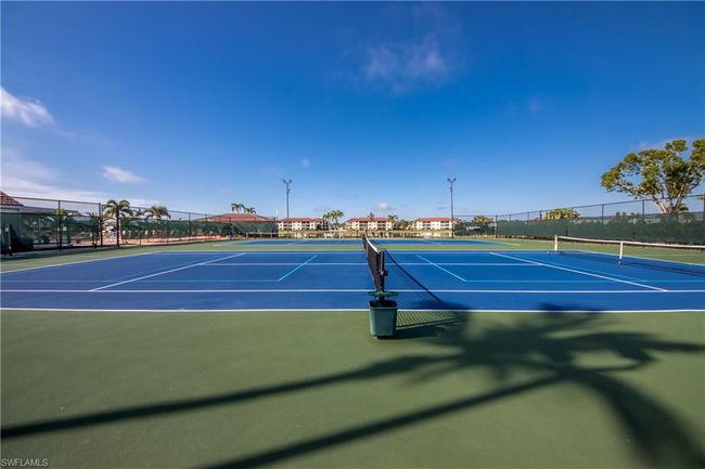 View of tennis court with basketball hoop | Image 16
