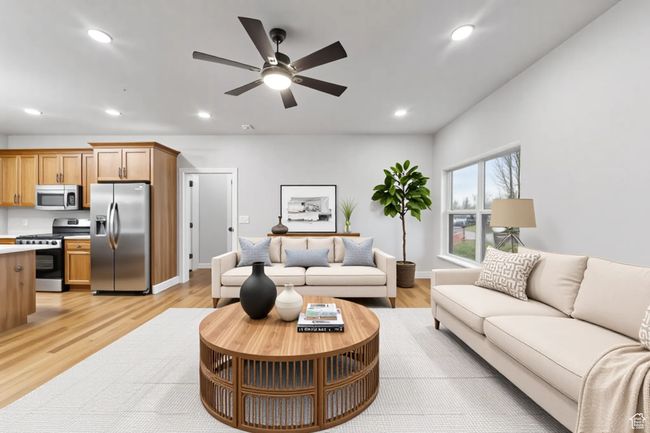 Living area with ceiling fan, recessed lighting, light wood-style floors, and baseboards | Image 8