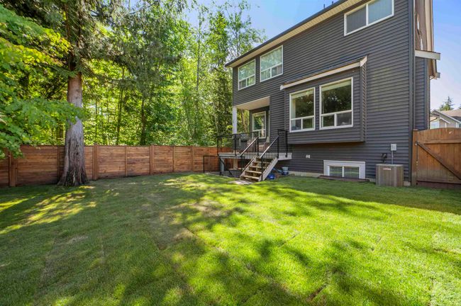 Rear view of house with cooling unit | Image 35