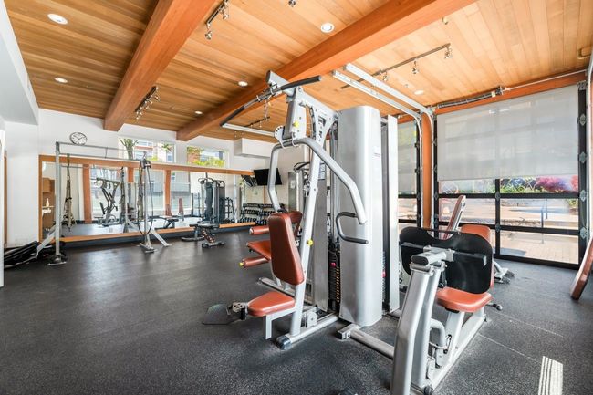 Exercise room with track lighting and wood ceiling | Image 24