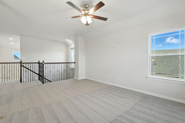 Unfurnished room featuring carpet, a ceiling fan, recessed lighting, and vaulted ceiling | Image 23