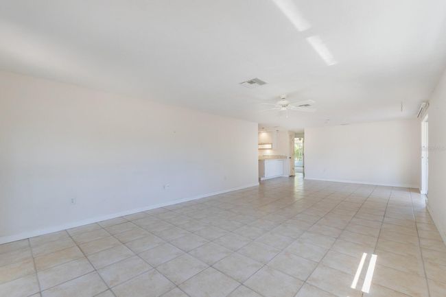 The great room has ample natural light with windows on the west side overlooking the large yard. | Image 6