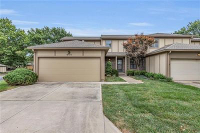 View of front of house featuring a garage and a front yard | Image 1