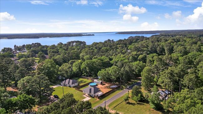 Birds eye view of property with a water view and a forest view | Image 35