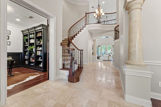 Front Entrance with view of the front office/extra room, staircase and living room. | Image 6