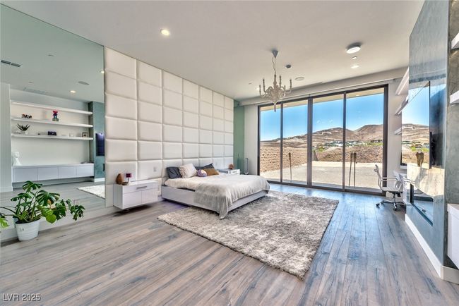 Bedroom with access to exterior, recessed lighting, wood finished floors, visible vents, and a mountain view | Image 18