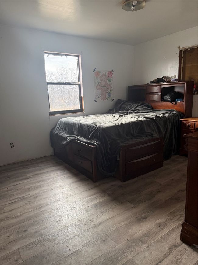 Bedroom featuring light wood-type flooring | Image 12