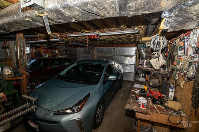 Garage featuring a garage door opener | Image 42
