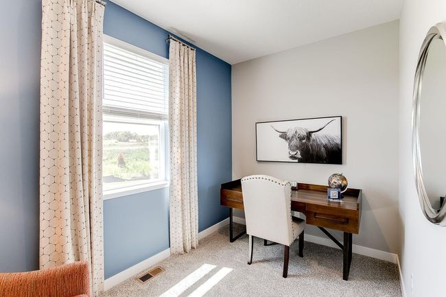 Main floor flex room creates a versatile space for you to use how you want. Photo of model home, color & options may vary. | Image 9
