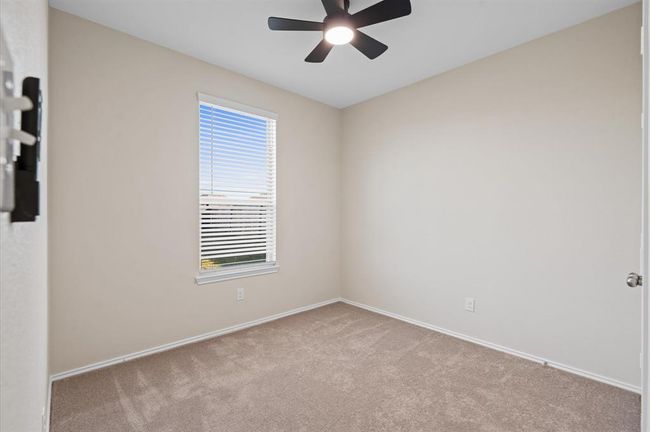 Secondary bedroom #1 downstairs, it can be a bedroom or an office. New carper and new ceiling fan. | Image 15