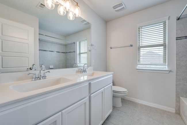 Full bathroom with a sink and light tile patterned flooring | Image 7