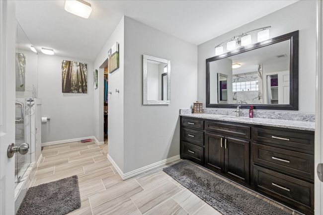Updated and spacious master bath, offering a modern and comfortable retreat. | Image 16