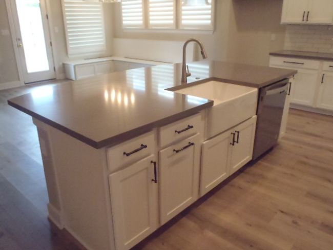 Kitchen with stainless steel dishwasher, plenty of natural light, and light wood finished floors | Image 16