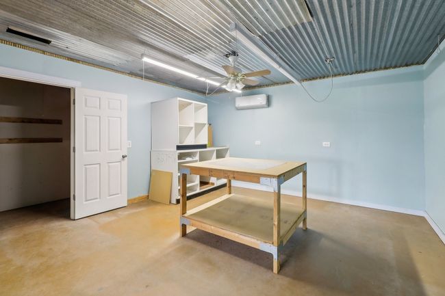 room with mini split in workshop | Image 23