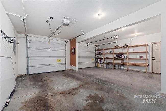 Garage with a garage door opener | Image 48