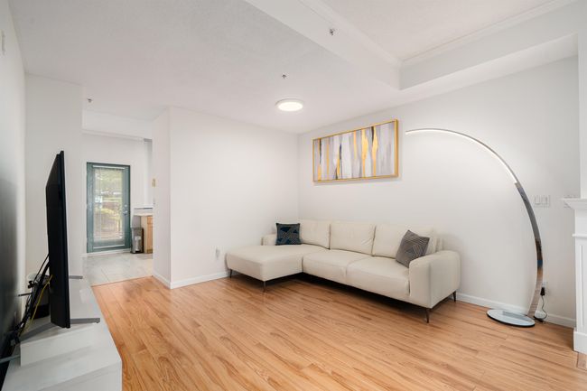 Living room featuring light wood-style floors | Image 7