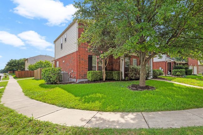 Featuring a side entry garage tucked behind the home | Image 4