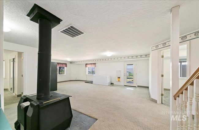 Community lobby featuring a textured ceiling | Image 24