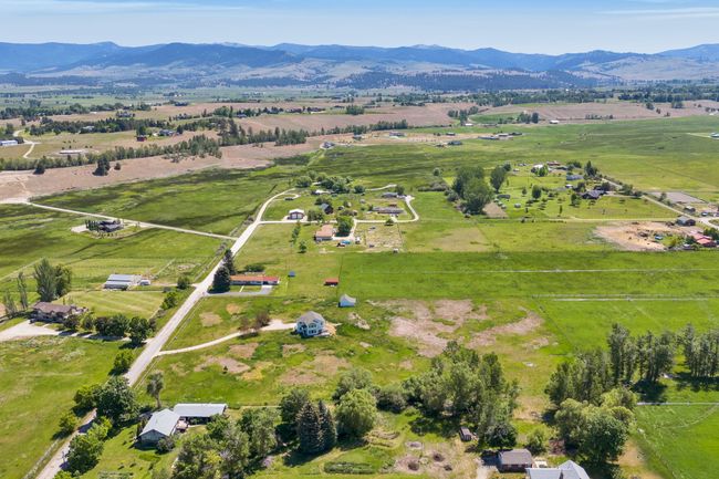 Aerial overview of property's location with rural landscape, a mountain backdrop, and a pastoral area | Image 63