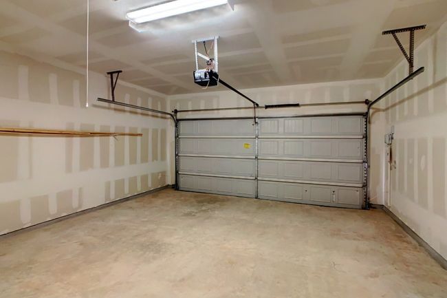 Garage with a garage door opener | Image 23
