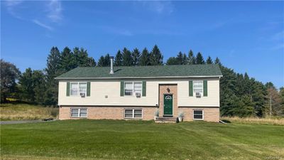 Raised ranch featuring a front yard | Image 1