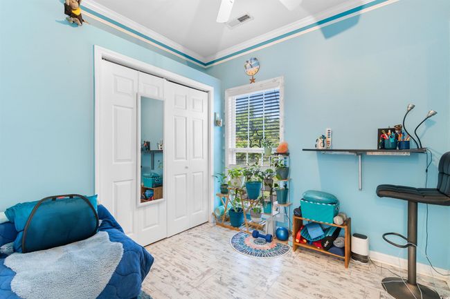 Sitting room featuring ornamental molding, ceiling fan, and wood finished floors | Image 10