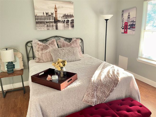 Bedroom with hardwood / wood-style flooring | Image 11
