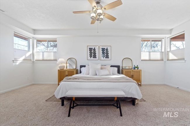 Bedroom featuring light carpet and a ceiling fan | Image 27