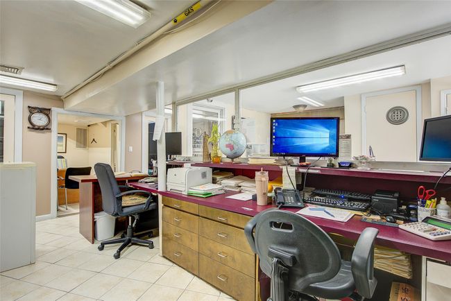 Office space with light tile patterned flooring | Image 11
