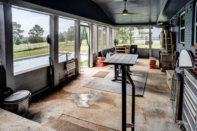 Sunroom / solarium featuring ceiling fan and vaulted ceiling | Image 30