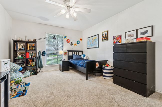 Carpeted bedroom featuring a ceiling fan | Image 17