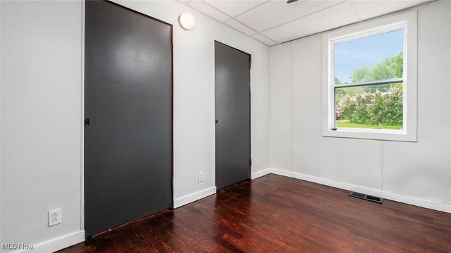 Bedroom 2 with dark wood-style flooring and a paneled ceiling | Image 10