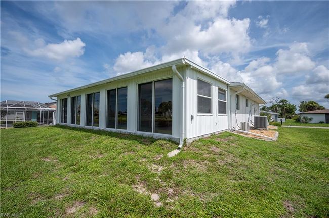 Rear view of property with a yard | Image 34