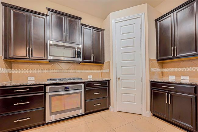 4914 Woodbury Mill Dr, House other with 4 bedrooms, 2 bathrooms and 2 parking in Spring TX | Image 5