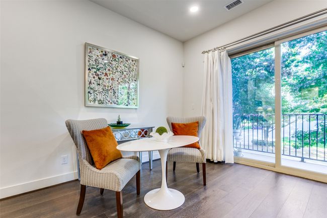 Sitting room or dining room - this flex space can be designed for your personal living style! Featuring plenty of natural light and pretty views! | Image 12