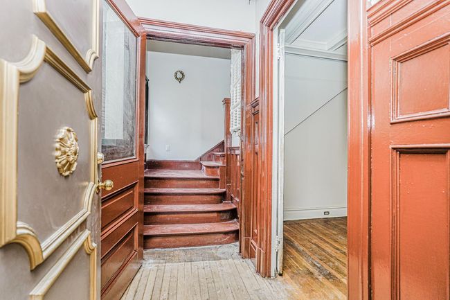 Stairs with hardwood / wood-style floors | Image 7