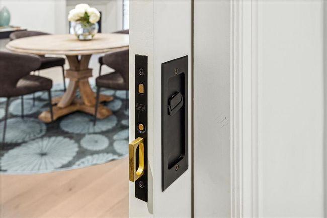 [Special Features] Custom features throughout this fabulous home, such as pocket doors adorned with brass hardware | Image 33