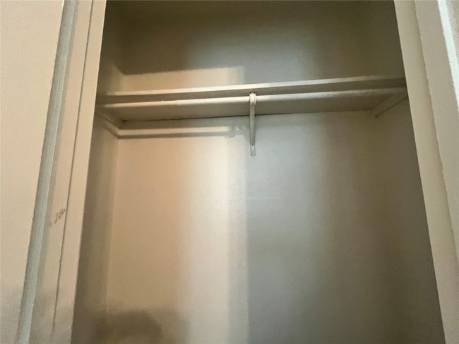 Here is a double closet. | Image 11