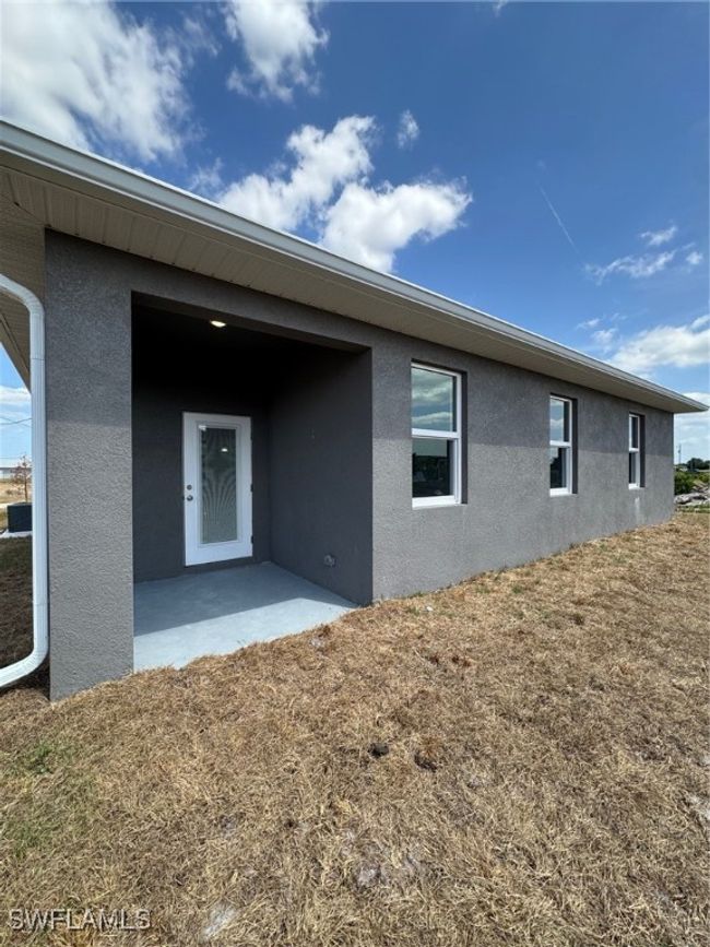 Rear view of house with stucco siding | Image 19