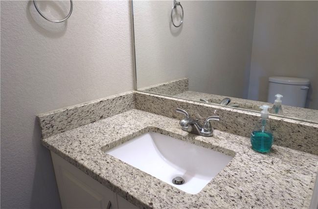 Half bath with vanity and toilet | Image 9