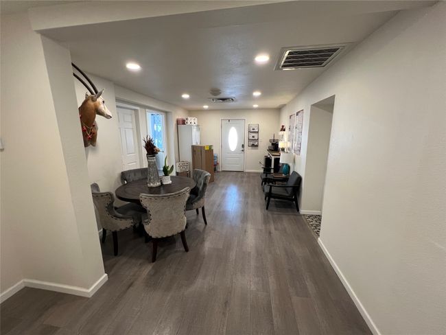 Dining area featuring recessed lighting, baseboards, and dark wood-style flooring | Image 24