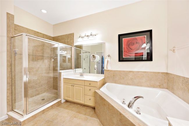 Bathroom with tile floors, separate shower and tub, and vanity with extensive cabinet space | Image 22