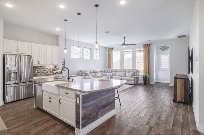 Kitchen featuring white cabinetry, and stainless steel appliances | Image 5