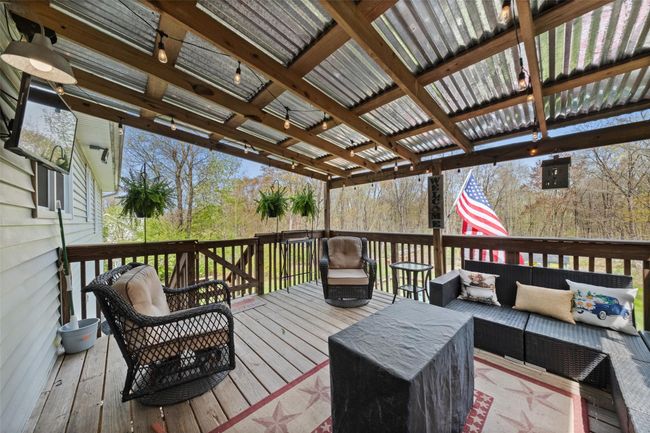 Wooden deck featuring outdoor lounge area | Image 26
