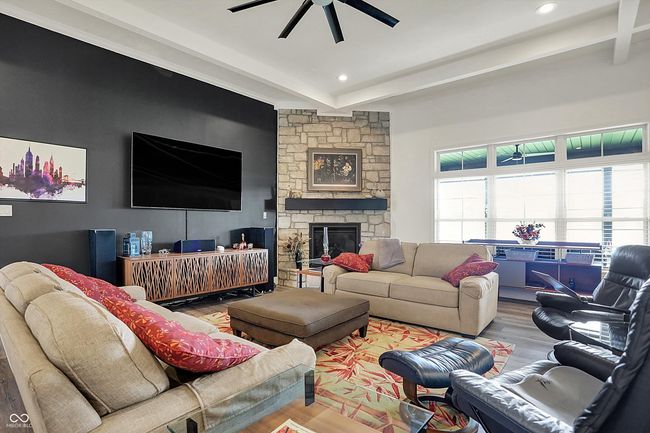 living room featuring recessed lighting, wood finished floors, a fireplace, and ceiling fan | Image 10